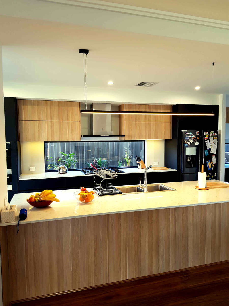 The natural look of simple of simple, light or medium toned solid wood, veneer or woodgrain laminate faced cabinetry