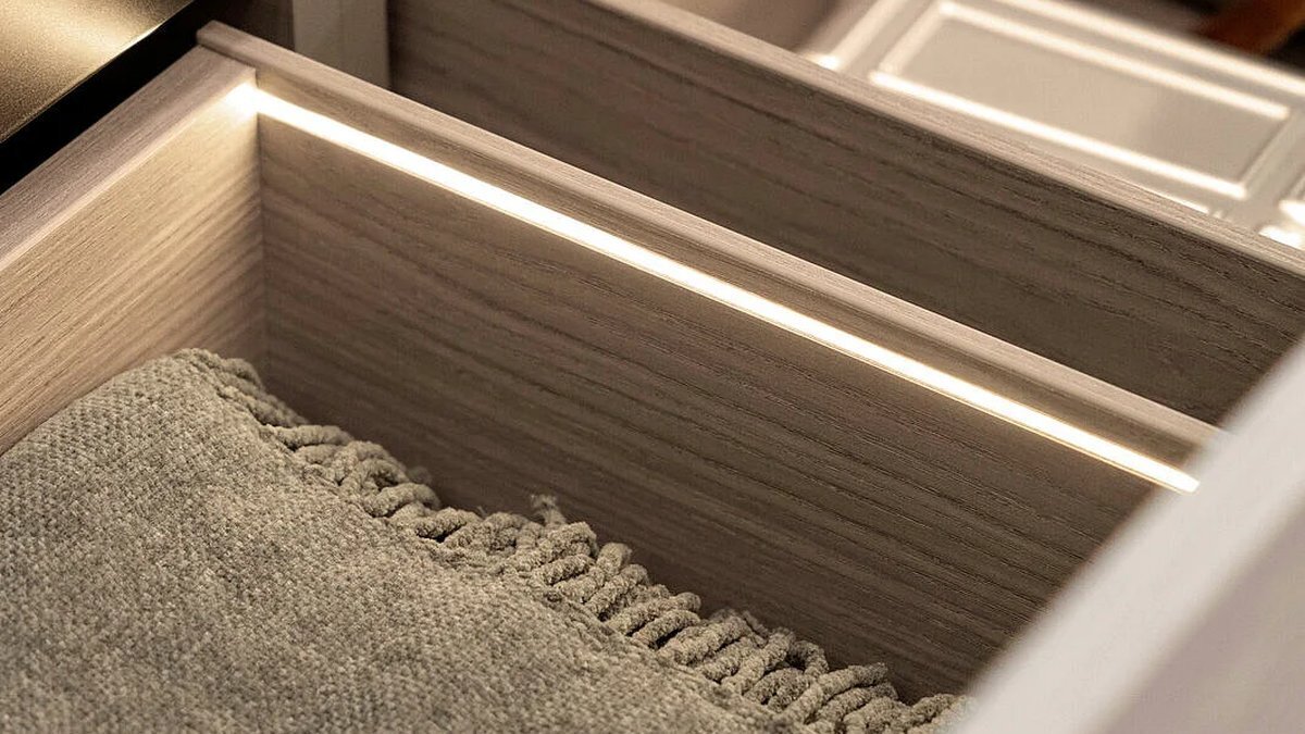 AvanTech YOU Illumination LED profile lighting the inside of a kitchen drawer